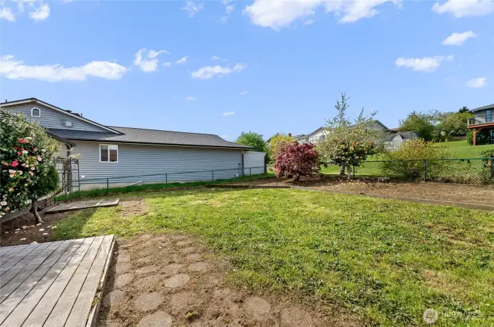 Rear yard, fully fenced for your pets, gardening and more!