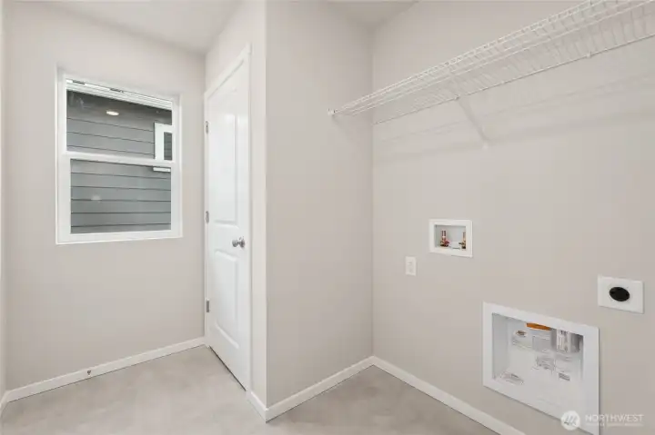 Convenient upstairs laundry room featuring. Photos are representative only and may display different color packages and/or upgrades. Convenient upstairs laundry room featuring. Photos are representative only and may display different color packages and/or upgrades.