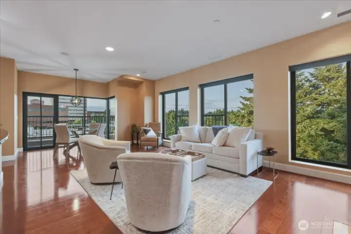 Living Room, hardwood floors, high ceilings, large windows, corner unit