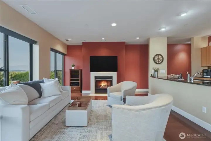 Living Room, hardwood floors, high ceilings, large windows, corner unit, gas fireplace
