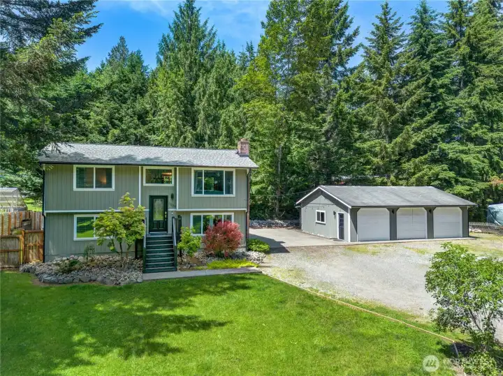 The expansive lot is designed for enjoying life outdoors, with plenty of room to entertain and unwind. A detached 3-car shop with workspace and a finished third bay adds even more utility to a property already designed to accommodate a variety of needs.
