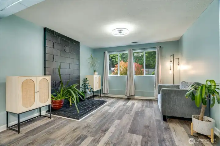 The lower level includes a generous family room with vinyl plank flooring, newer paint and trim, two bedrooms, and a full bath. A great option for multi-generational living, guests, hobbies, or simply creating additional separation between living spaces.