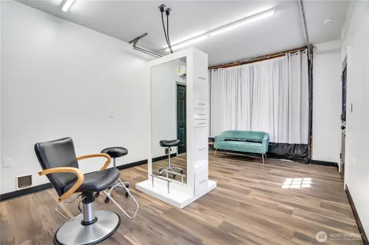 If you decide having more garage space is your true desire, this room is easily re-converted back as the garage door is still present behind the white curtain.