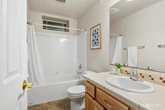 Full bathroom on daylight basement level.