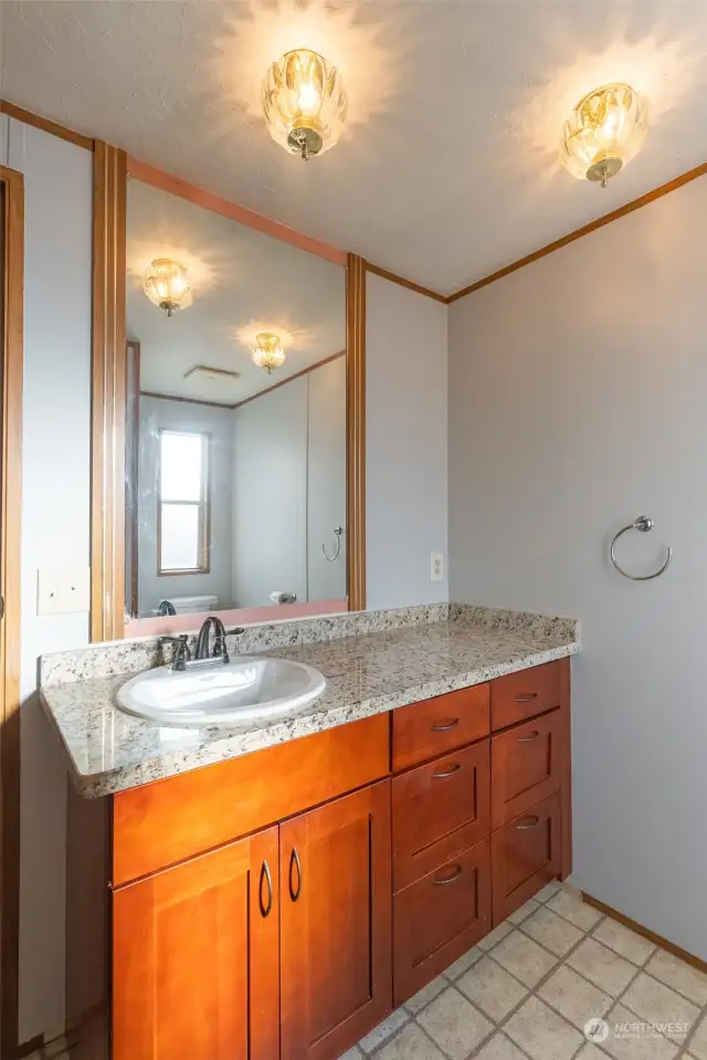 Updated vanity with granite countertops