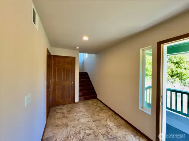 Entry w coat closet straight ahead, garage door on left