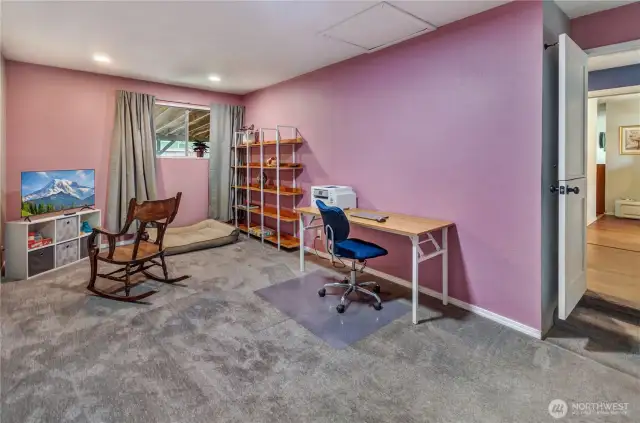Versatile office or flex space with endless possibilities—perfect for working from home, hobbies, a playroom, or even a cozy movie spot. Fresh carpet, built-in shelving, and great natural light make it both functional and inviting!