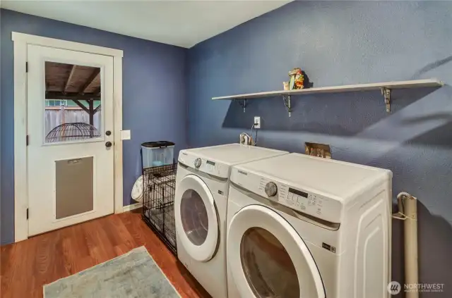 Convenient laundry room with backyard access and bonus storage shelf! Washer and dryer stay with the home—making move-in day that much easier.