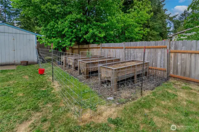 Grow your own paradise! These raised garden beds are fenced and ready for your favorite herbs, veggies, or flowers—perfect for anyone with a green thumb or aspiring gardener dreams.