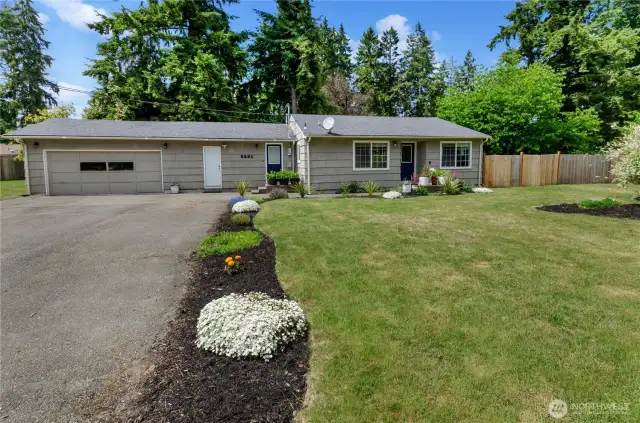 Charming curb appeal with fresh landscaping and a welcoming front entry! This beautifully maintained home sits on a spacious lot with a large driveway and a two-car garage—your perfect blend of comfort and convenience