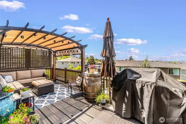 Deck off main floor with incredible views, privacy screens and rubber tile decking