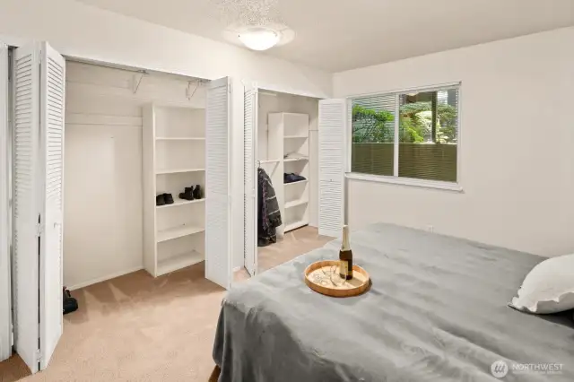 Primary bedroom has large double closets.