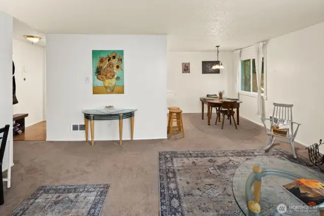 The dining room opens into a large open living room space.