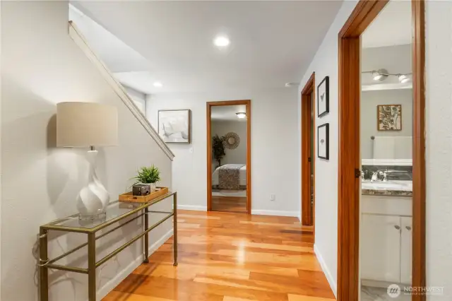 Spacious entry to lower level bedrooms & bath w/ engineered Cherry wood floors.