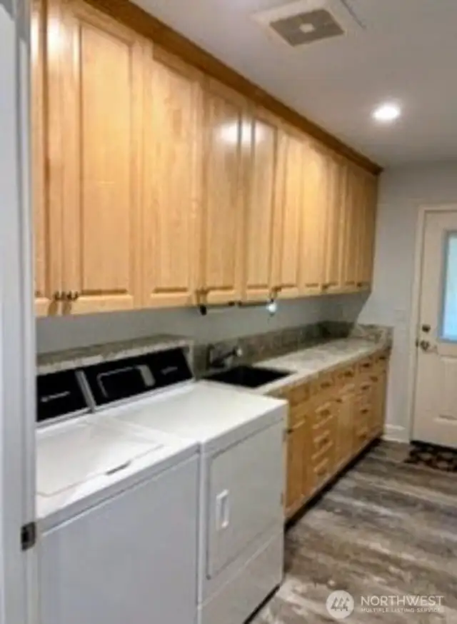 Spacious laundry room with lots of storage and more solid maple cabinets. #1250 Northcliff Rd, Shelton, WA 98584