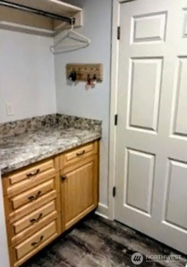 Spacious laundry room with lots of storage and more solid maple cabinets. #1250 Northcliff Rd, Shelton, WA 98584