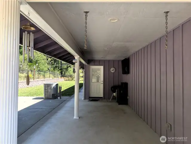 Rear patio area, with covered section with flat screen TV that stays. Ideal for entertaining. #1250 Northcliff Rd, Shelton, WA 98584