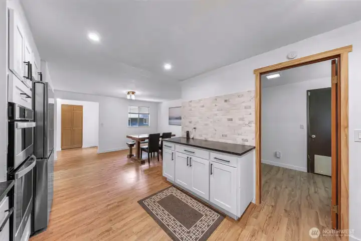 Great storage with extra cabinetry. Direct access to laundry room and garage.