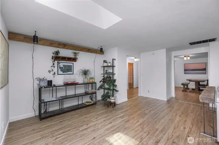 Extra large living room has extra space for an office set up, reading nook, or plant wall.
