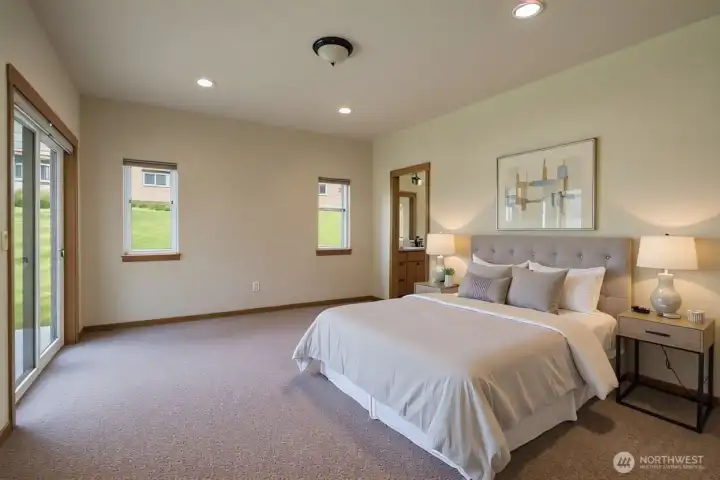 Primary bedroom (virtually staged) with slider to patio