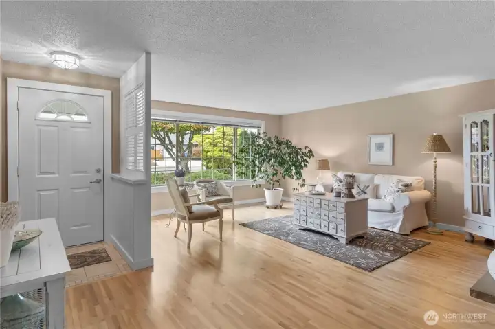 Sparkling Original hardwoods welcome you in to the front side living room