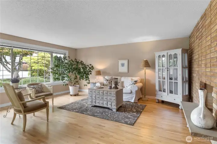 Sparkling Original hardwoods welcome you in to the front living room