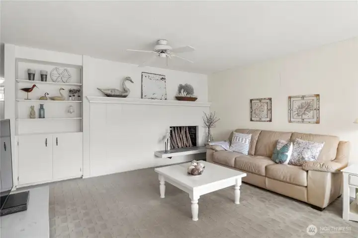 Back living room & dining with second wood-burning fireplace