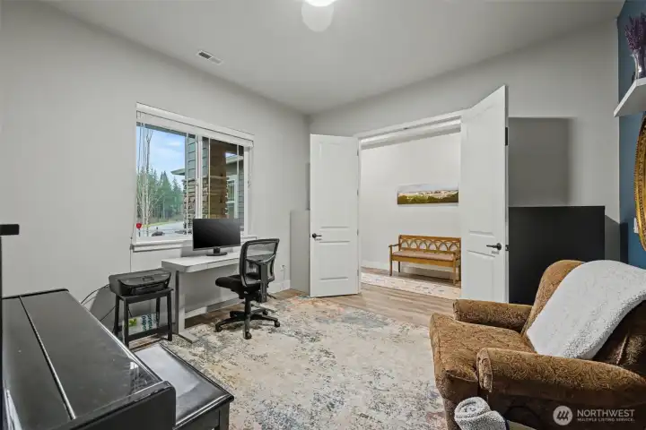 Looking back toward the foyer from the office, this view highlights the easy flow between spaces, with elegant double doors that add both style and flexibility to the layout.