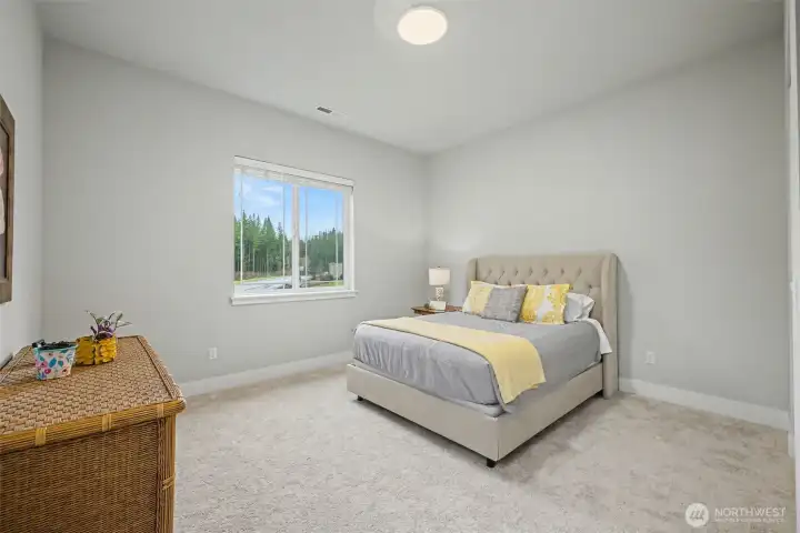 Guest room on the front of the house, featuring a large walk in closet.