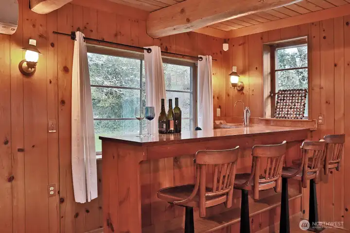 The adjacent bar area invites relaxed entertaining.