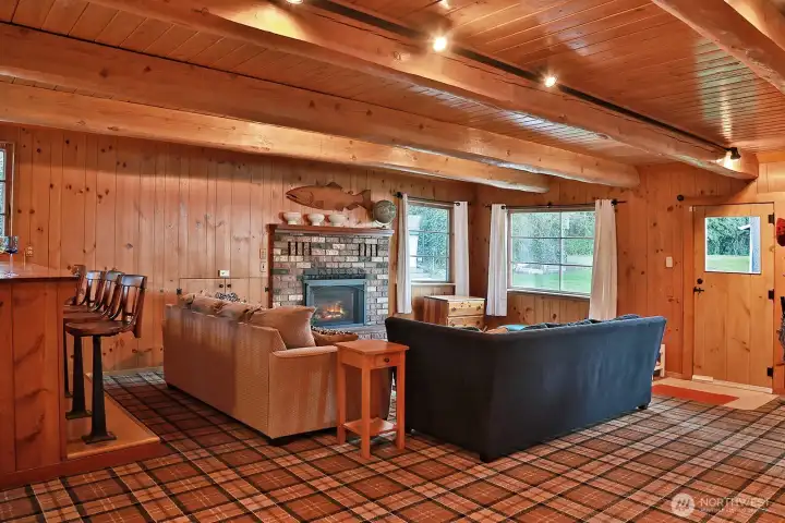 A warm and inviting great room anchored by timeless craftsmanship.