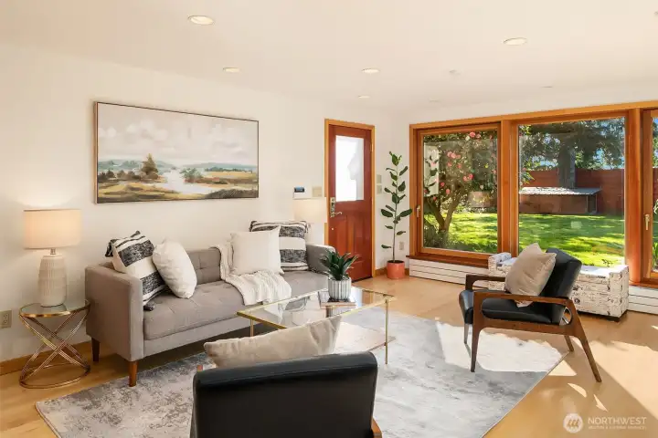 Lower Level Family Room with Exterior Door to Outdoor Living Spaces & Gardens