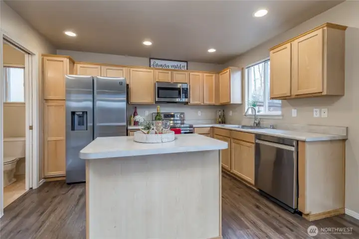 Convenient center island offers extra storage and prep space