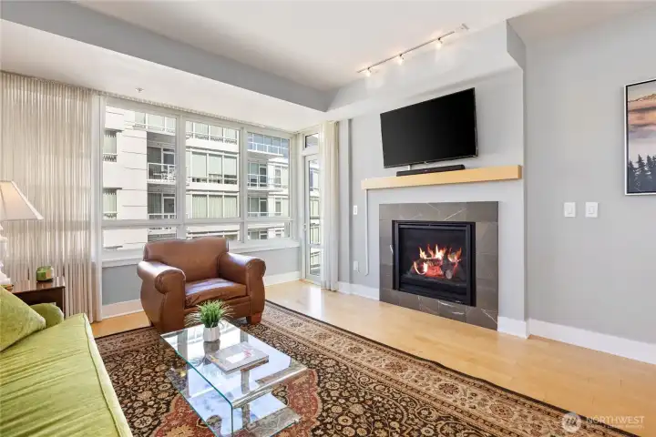 The glass door to left of fireplace leads to a water facing deck.