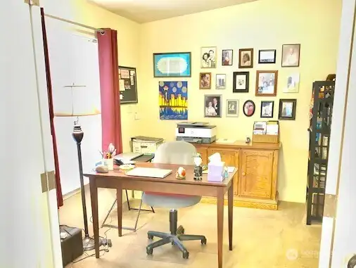 A den, or possibly a third bedroom, is located just off the living room.