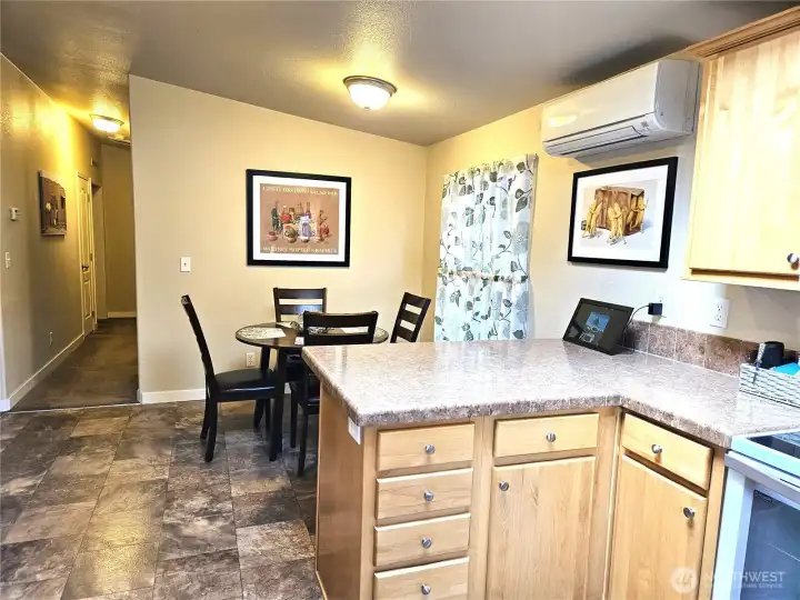 The kitchen offers plenty of workspace and ample storage.
