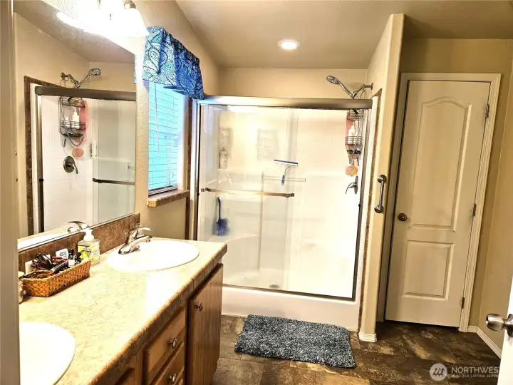 Primary bath features double sinks, raised toilet/bidet and walk-in shower and large linen closet.