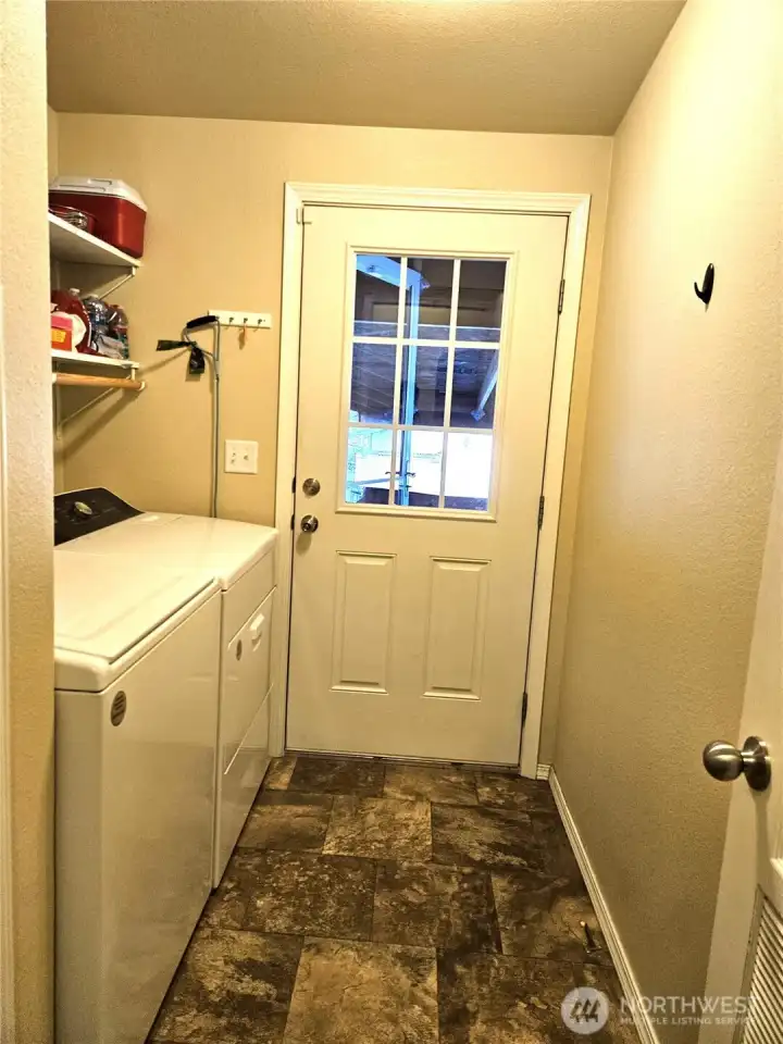 Laundry room off the back porch, with washer and dryer.