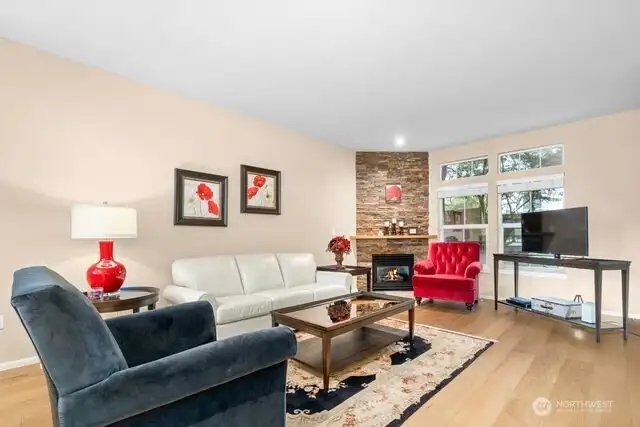 Living Room is spacious, light and bright.  Brand new flooring is beautiful!