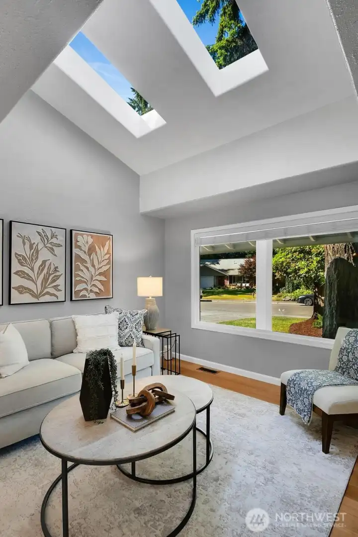 Entertain one or many in spacious, handsomely appointed Living Room.  New energy-efficient windows with custom Louver Blinds (throughout), vaulted ceiling with skylights