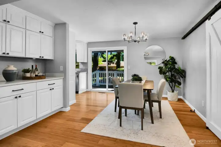 Custom built-in lighted granite hutch service counter, generous custom storage cabinets floor to ceiling