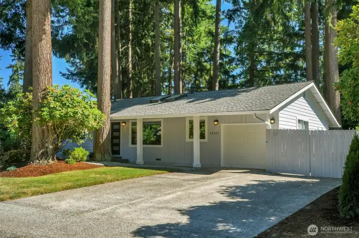 Spacious 4-car driveway, gated RV/Boat Bay, deep garage with storage