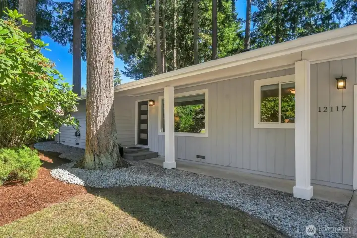 Covered walkway, ranch-style Cedar siding, slate entry