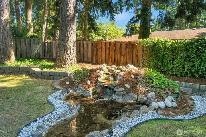 A charming gurgling waterfall welcomes the aviary at sunrise; nightlit serenity at dusk.