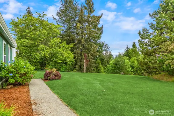 Concrete paths connect the home and shop with ease.