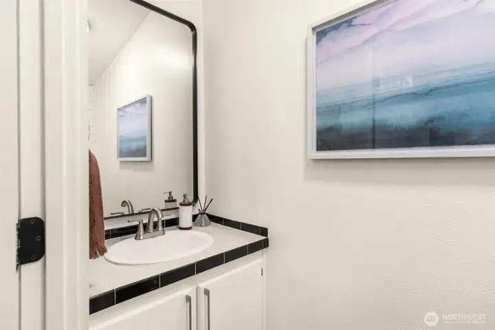 Half bath conveniently located at the front of the home.