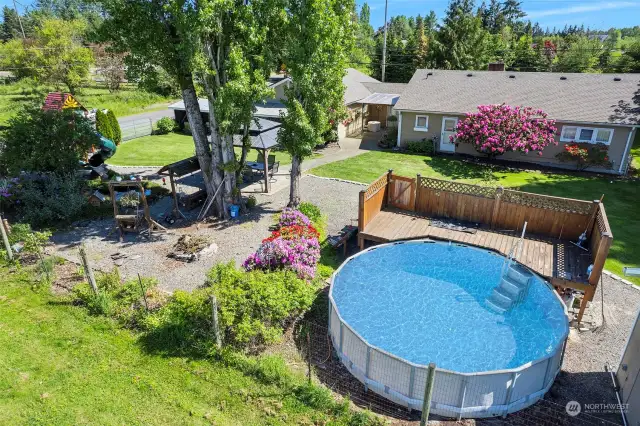 ~View of Pool & Fire Pit surrounded by flowers galore~