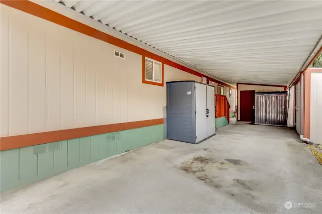 Side carport with tons of storage areas and sheds