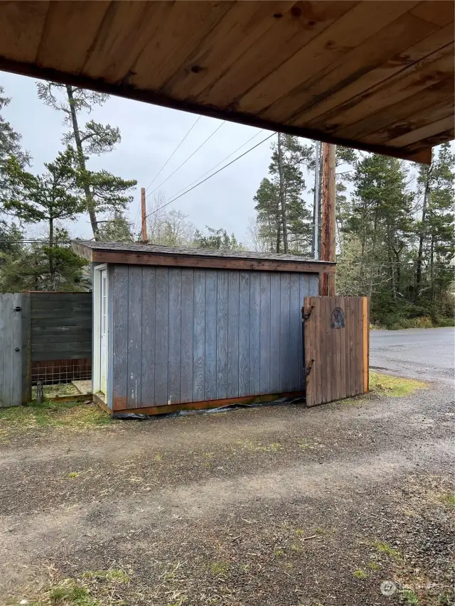 Shed connected to dog run or for goats.