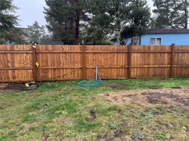 6 foot privacy fence around entire perimeter of property. 5 water hook-ups located from south of property to north of property, even spaced for convenience.